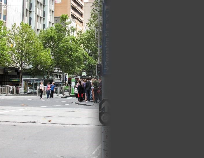 Demonstration of vision impacted by a right hemianopia stroke with a street crossing and sign on a streetscape